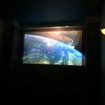 Home theater room with a big screen