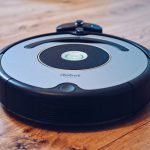 Robot vacuum on a wooden floor