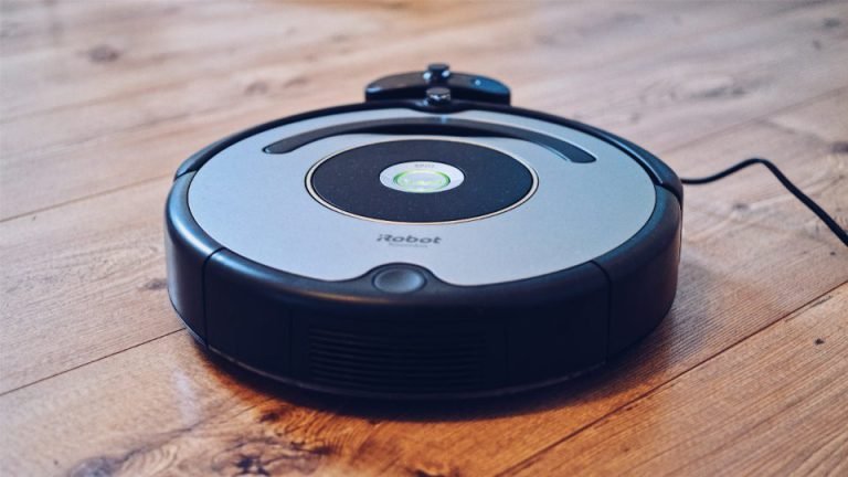 Robot vacuum on a wooden floor