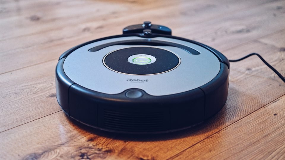 Robot vacuum on a wooden floor